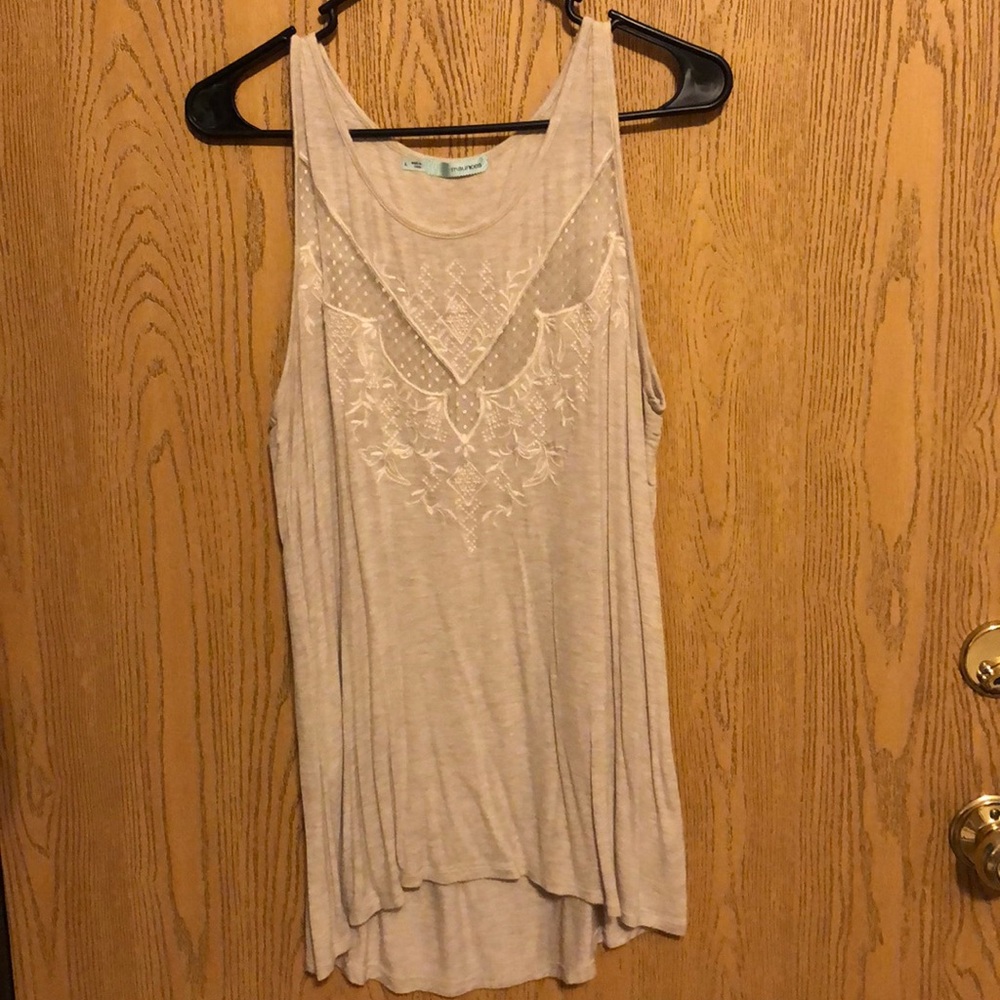 Maurice’s tank top